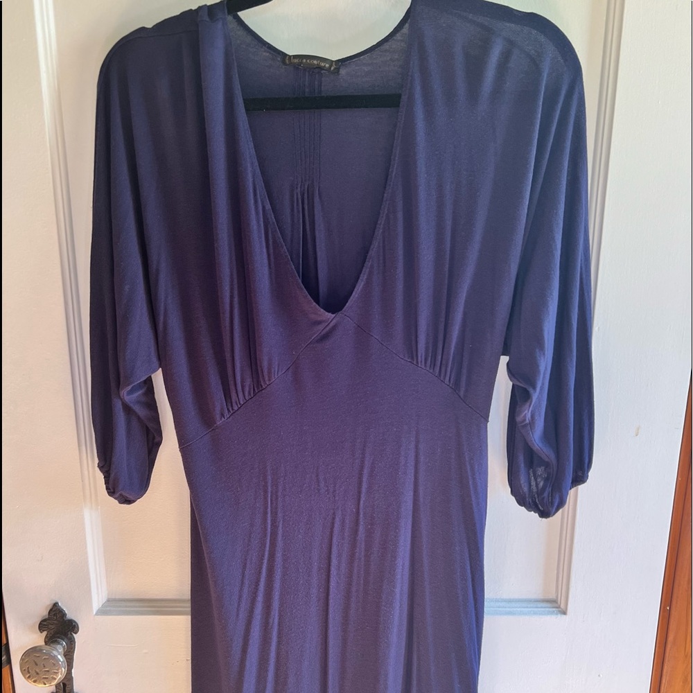 Navy blue dress with gold detail on the back.